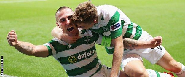 Scott Brown celebrates scoring with Celtic team-mate James Forrest