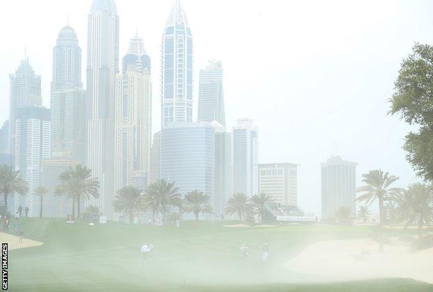 The winds also saw sand from bunkers cause problems for players