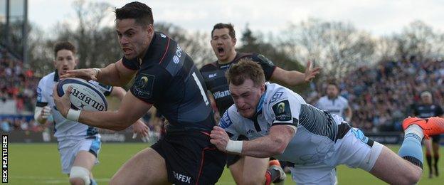 Saracens' Sean Maitland is tackled by Glasgow's Stuart Hogg