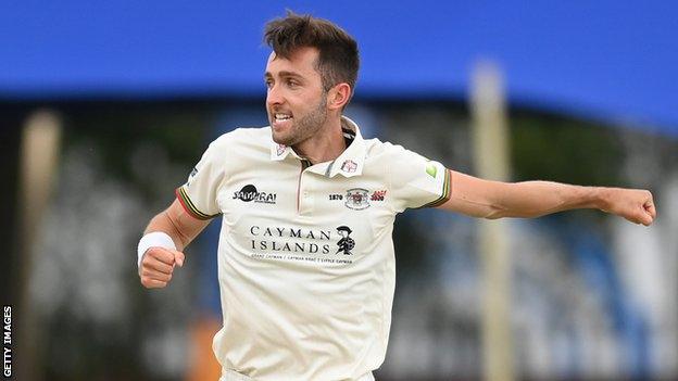 Gloucestershire bowler Matt Taylor celebrates taking a wicket against Middlesex