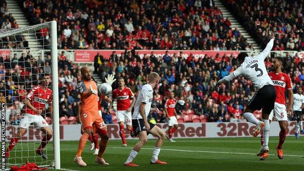Middlesbrough goalkeeper Darren Randolph reacts to keep out Swans defender Martin Olsson's first-half header