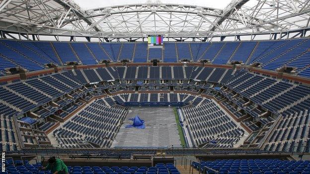 Tarpaulins on Arthur Ashe Court