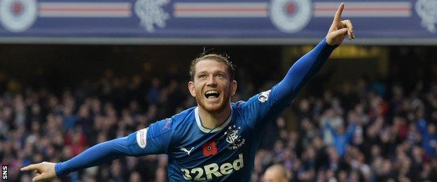 Joe Garner celebrates scoring Rangers' third goal