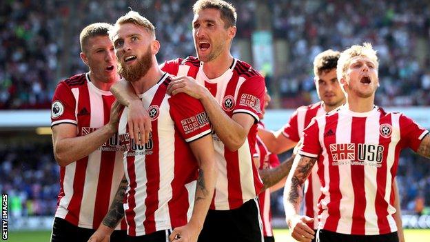 Oliver McBurnie (second left) celebrates scoring for Sheffield United