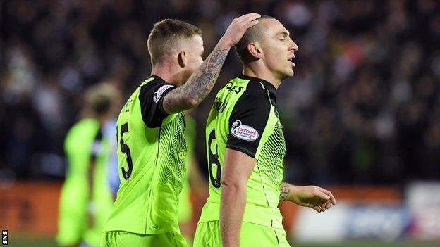 Jonny Hayes commiserates with Scott Brown after he is given his marching orders