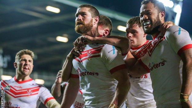 St Helens celebrate Kyle Amor (centre) scoring against Hull KR