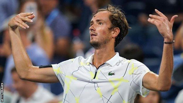 Daniil Medvedev encourages the Louis Armstrong Stadium crowd to boo him after beating Dominik Koepfer in the US Open fourth round