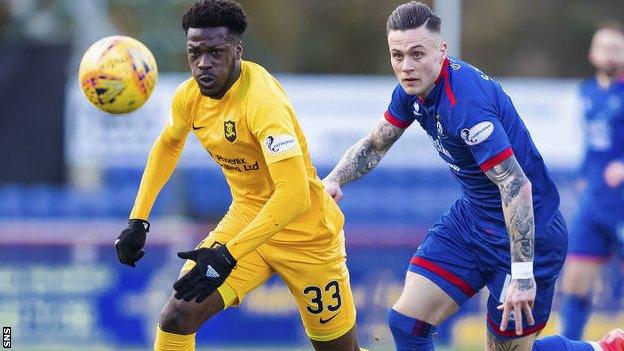 Livingston defender Steve Lawson and Inverness striker Miles Storey