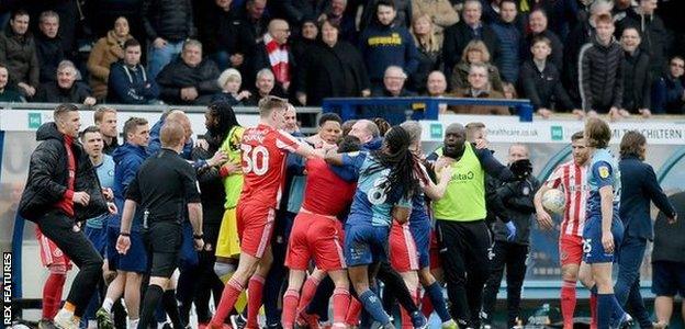 Wycombe and Sunderland players clash