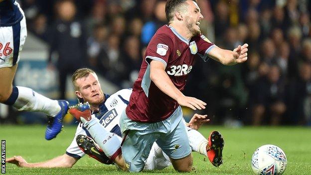 Chris Brunt fouls John McGinn