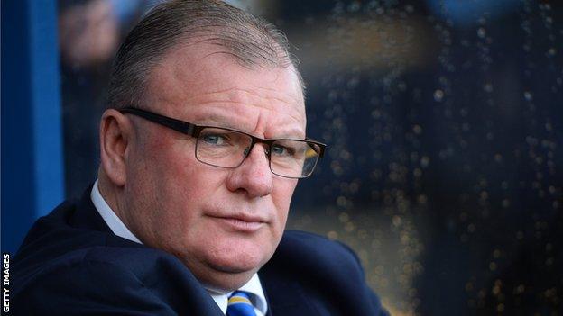 Steve Evans in the Mansfield dugout