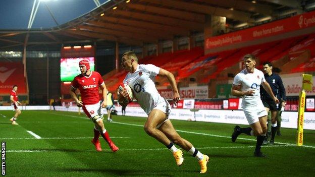 England centre Henry Slade scores the first try for the visitors which Wales coach Wayne Pivac disputes