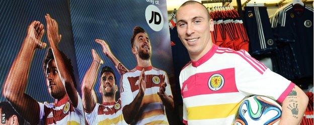 Scotland captain Scott Brown wears the previous away kit