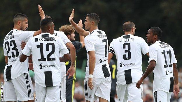 Cristiano Ronaldo (centre) celebrates with his teammates after opening the scoring for Juventus