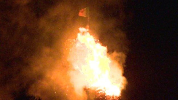 Irish tricolour flag burns on bonfire at Chobham Street in east Belfast