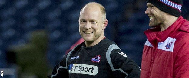 Edinburgh backs coach Duncan Hodge (centre) shares a joke with defence coach Peter Wilkins