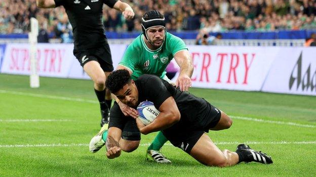 Leicester Fainga'anuku of New Zealand scores against Ireland