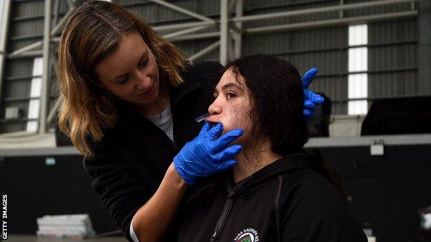 A mouthguard is fitted to a player