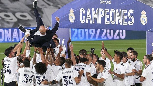 Gareth Bale (R) watches Real Madrid's celebrations