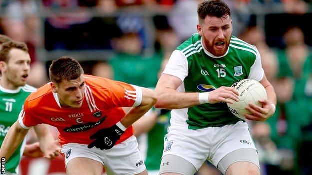 Armagh's Gregory McCabe puts pressure on Fermanagh forward Seamus Quigley in the Ulster SFC game