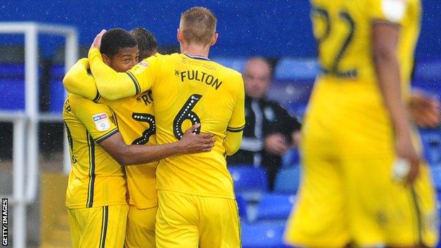 Swansea celebrate Brewster's goal