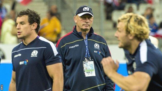 Scotland head coach Vern Cotter watches over his side's warm-up in Paris