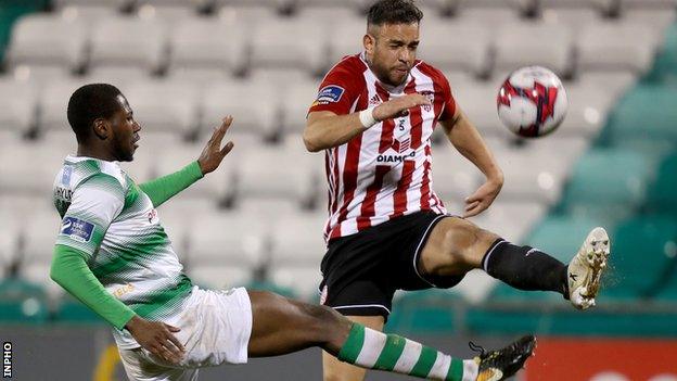 Rovers striker Dan Carr puts a challenge in on Derry's Darren Cole in Friday night's game