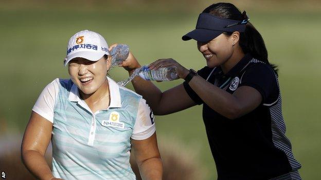 Lee Mi-Rim (left) has water poured on her by fellow South Korean Chun In-gee after her victory