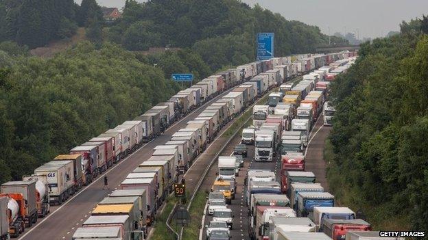 Lorries queue on four lanes across the motorway