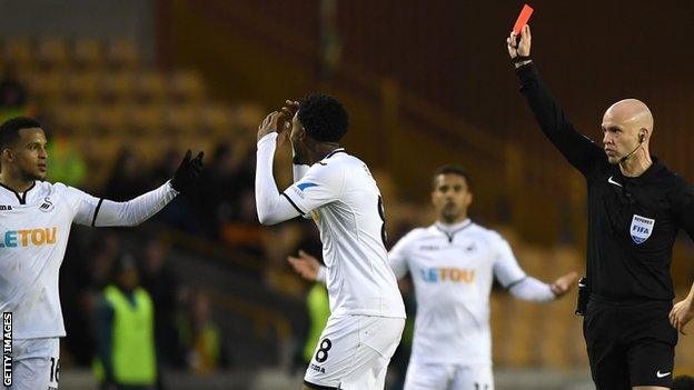 Swansea players protest red card