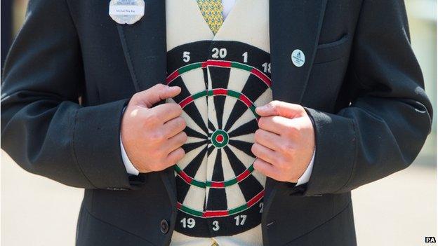 Racegoer Michael Roy wears a darts themed waistcoat during Ladies Day, on day three of the 2015 Royal Ascot Meeting at Ascot Racecourse, Berkshire