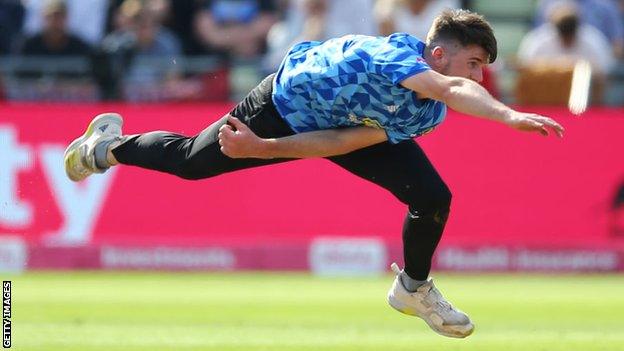 George Garton bowling for Sussex