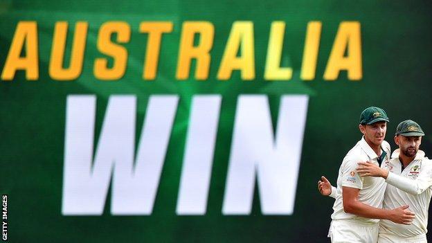 Josh Hazlewood (left) and Nathan Lyon celebrate Australia's win over Pakistan