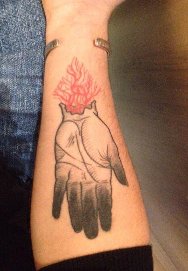 Bleeding hand tattoo