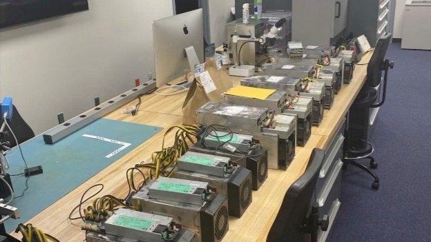 Photo of several computers seized by police