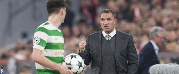 Celtic's Kieran Tierney receives instructions from Brendan Rodgers in Munich