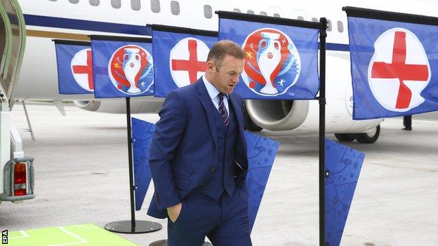 England captain Wayne Rooney leaves the plane as it lands at the Le Bourget Airport in Paris