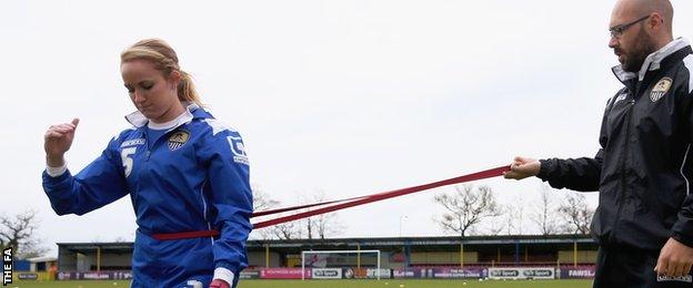 Sophie Bradley doing knee rehab pitchside