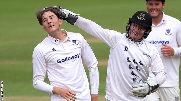 James Coles celebrate taking a wicket with Ben Brown