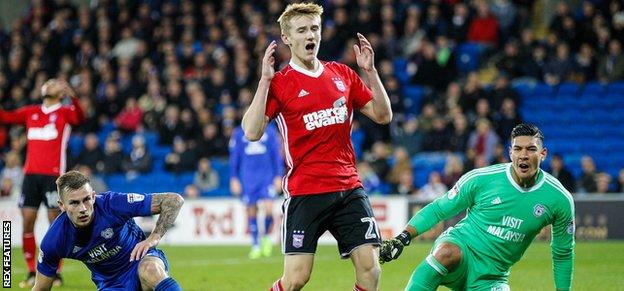 Ipswich's Flynn Downes reacts after his goal-bound shot was blocked by Joe Ralls