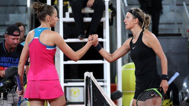 Karolina Pliskova and Victoria Azarenka shake hands at the net after their second round Madrid Open tie