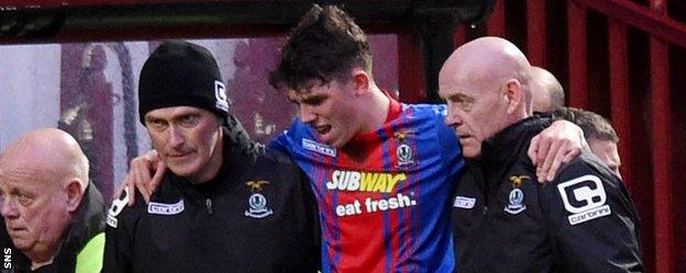 Inverness midfielder Ryan Christie is helped off against Motherwell