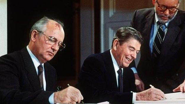 Mikhail Gorbachev and Ronald Reagan signing the INF Treaty in 1987