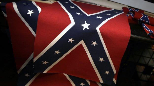 The Confederate battle flag being sold in shops.