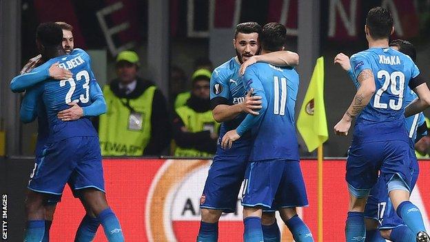 Arsenal celebrate their win in Milan