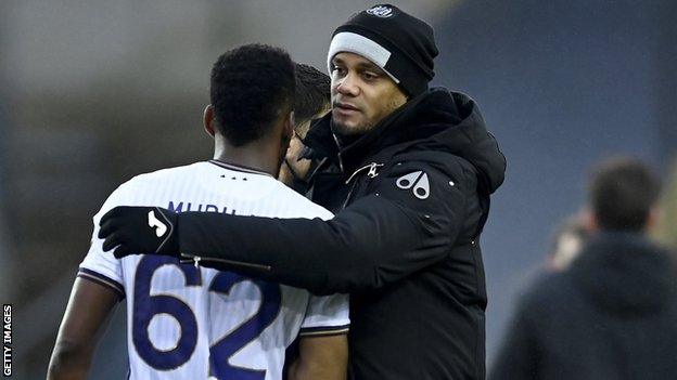 Vincent Kompany embraces Anderlecht defender Amir Michael Murillo after Sunday's game