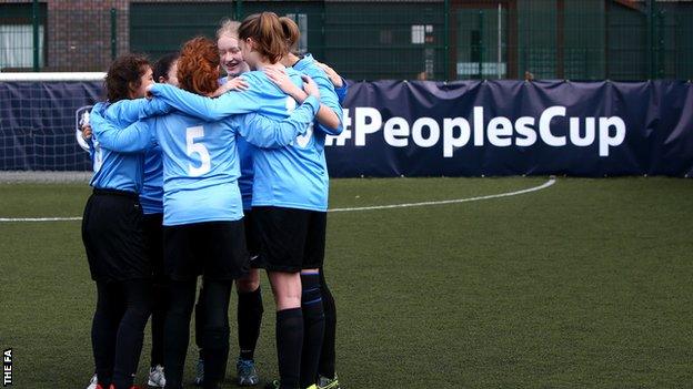 Girls football team huddle
