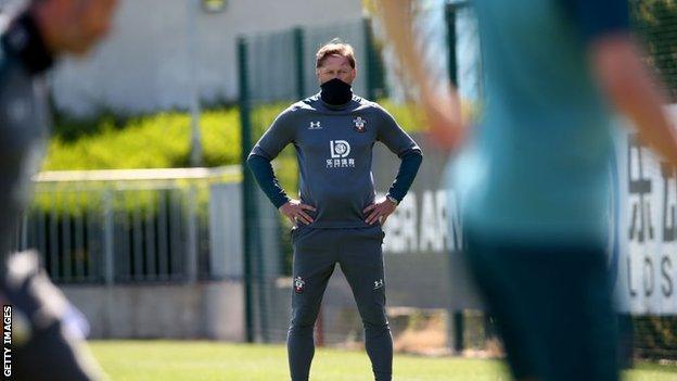 Southampton boss Ralph Hasenhuttl covered his mouth with a snood as he watched his players take part in Tuesday's training session