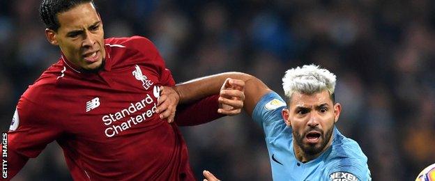 Liverpool’s Virgil van Dijk challenges Sergio Aguero of Manchester City