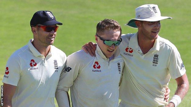 England bowlers James Anderson (left) and Stuart Broad (right) celebrate with Dom Bess (centre) after taking a wicket on day two of the second Test against South Africa